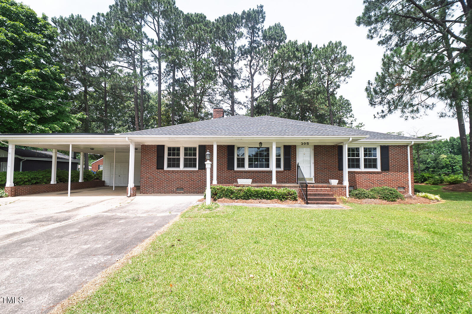 205 North Augusta Avenue Benson, NC 27504 - Photo 1 of 22 front view of a house with a yard