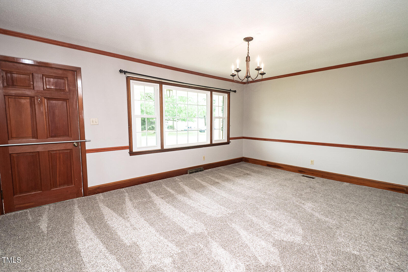 205 North Augusta Avenue Benson, NC 27504 - Photo 13 of 22 a view of an empty room with a window