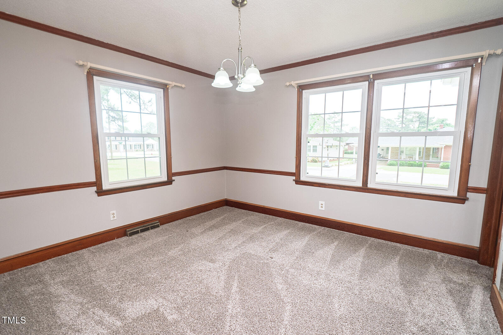 205 North Augusta Avenue Benson, NC 27504 - Photo 14 of 22 a view of an empty room with a window