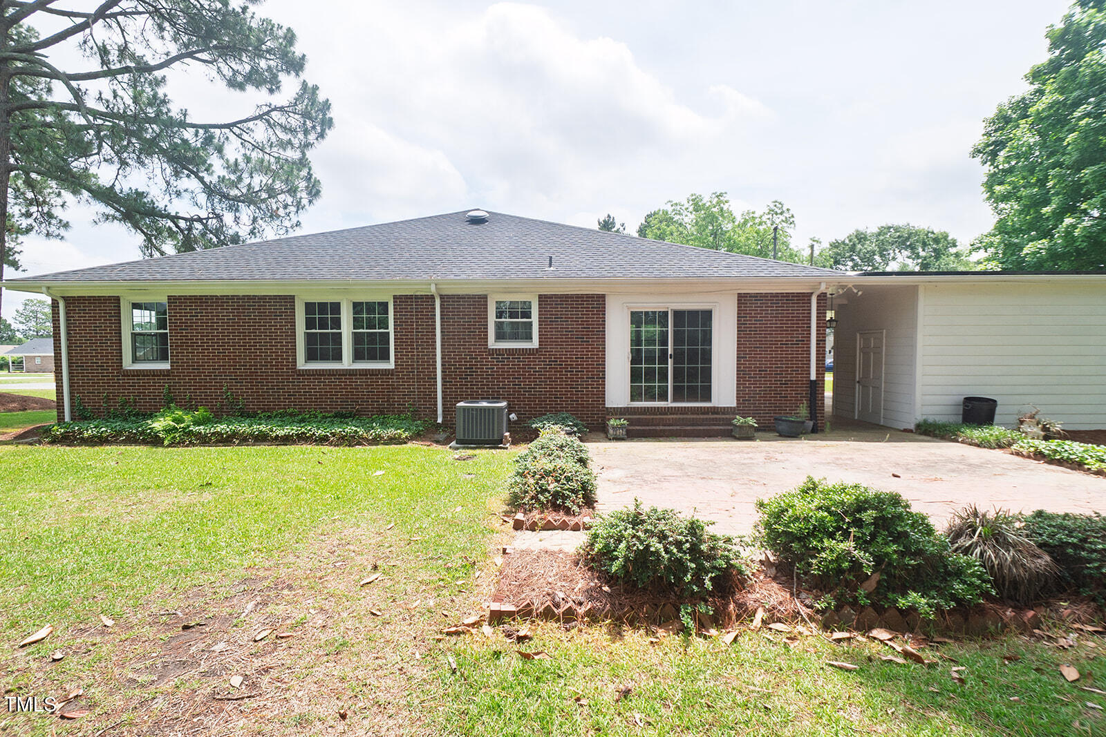205 North Augusta Avenue Benson, NC 27504 - Photo 21 of 22 front view of a house with a yard