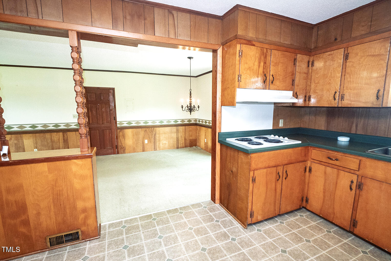 205 North Augusta Avenue Benson, NC 27504 - Photo 10 of 22 a kitchen with stainless steel appliances granite countertop a stove a sink and a microwave