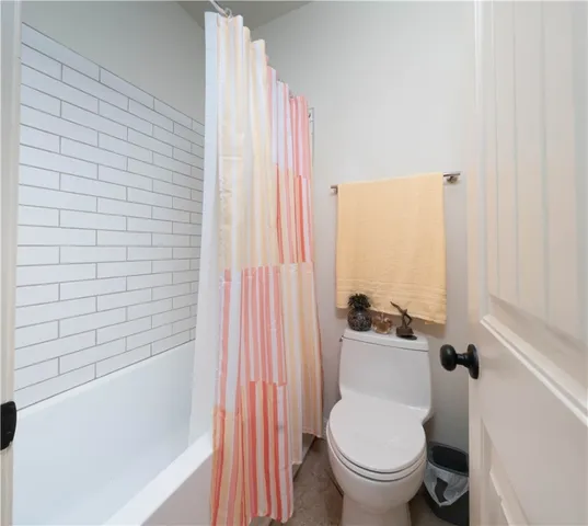 a bedroom with a bed and a book shelf