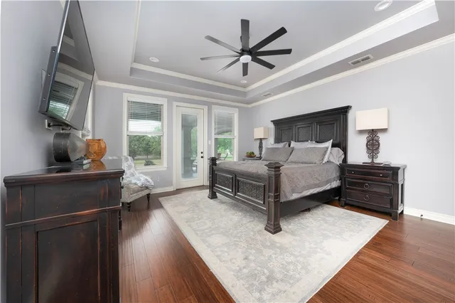 a spacious bathroom with a granite countertop tub sink and mirror