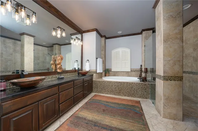 a bathroom with a bathtub and a shower