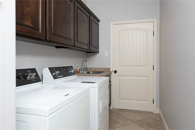 a view of a patio with table and chairs and potted plants