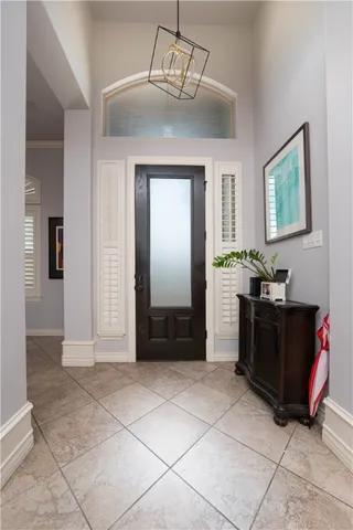 a living room with furniture kitchen view and a window