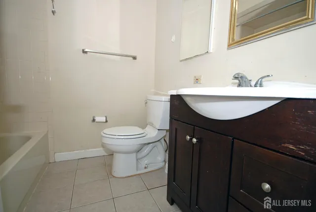 a bathroom with a sink toilet and vanity