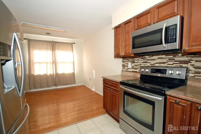 a kitchen with a stove and a microwave