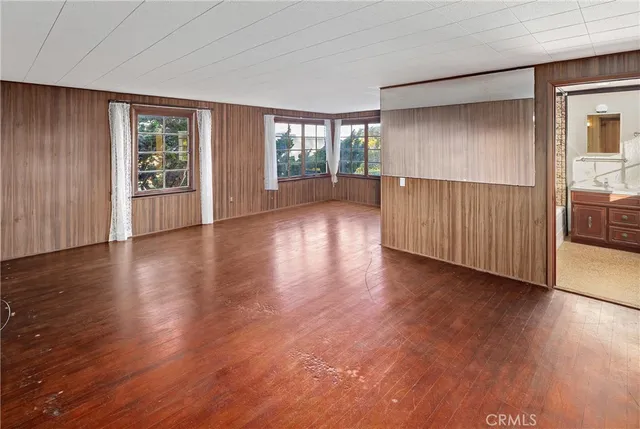 a view of a livingroom with wooden floor