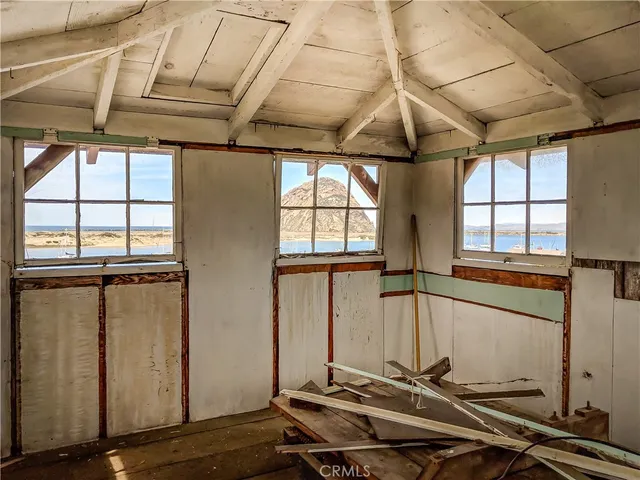 a front view of a house with yard and sitting area