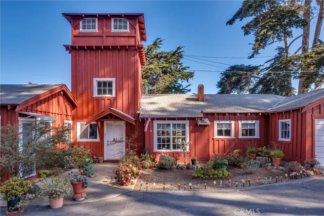 a front view of a house with yard