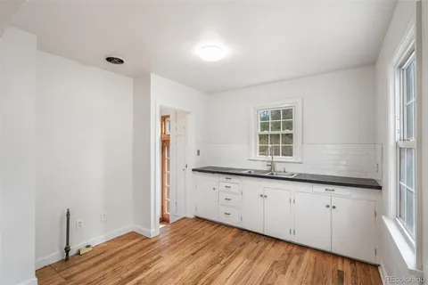 a bathroom with a sink and a window