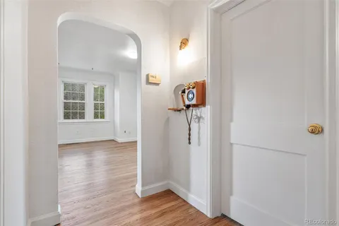 an empty room with wooden floor and closet