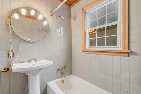 a bathroom with a sink and a bathtub