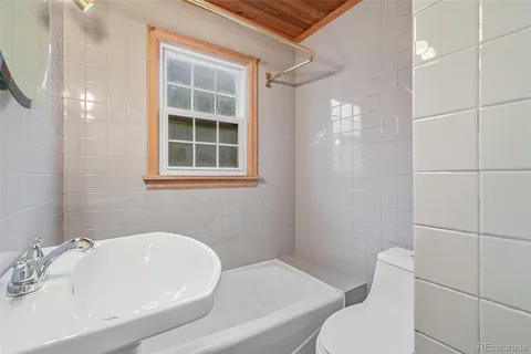 a bathroom with a sink and toilet
