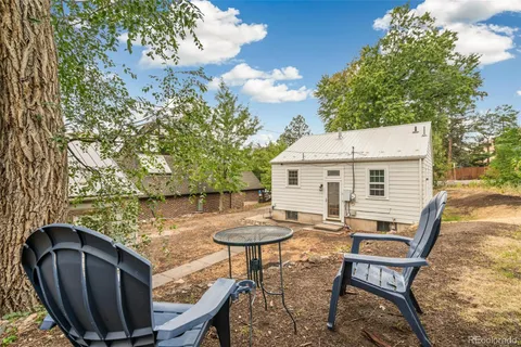 a view of a chairs and table in the balcony