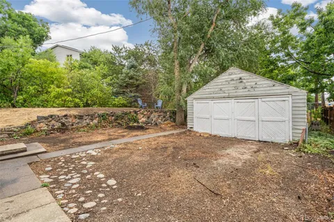 a view of backyard and garage