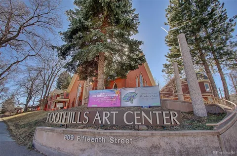 a view of a house with a tree