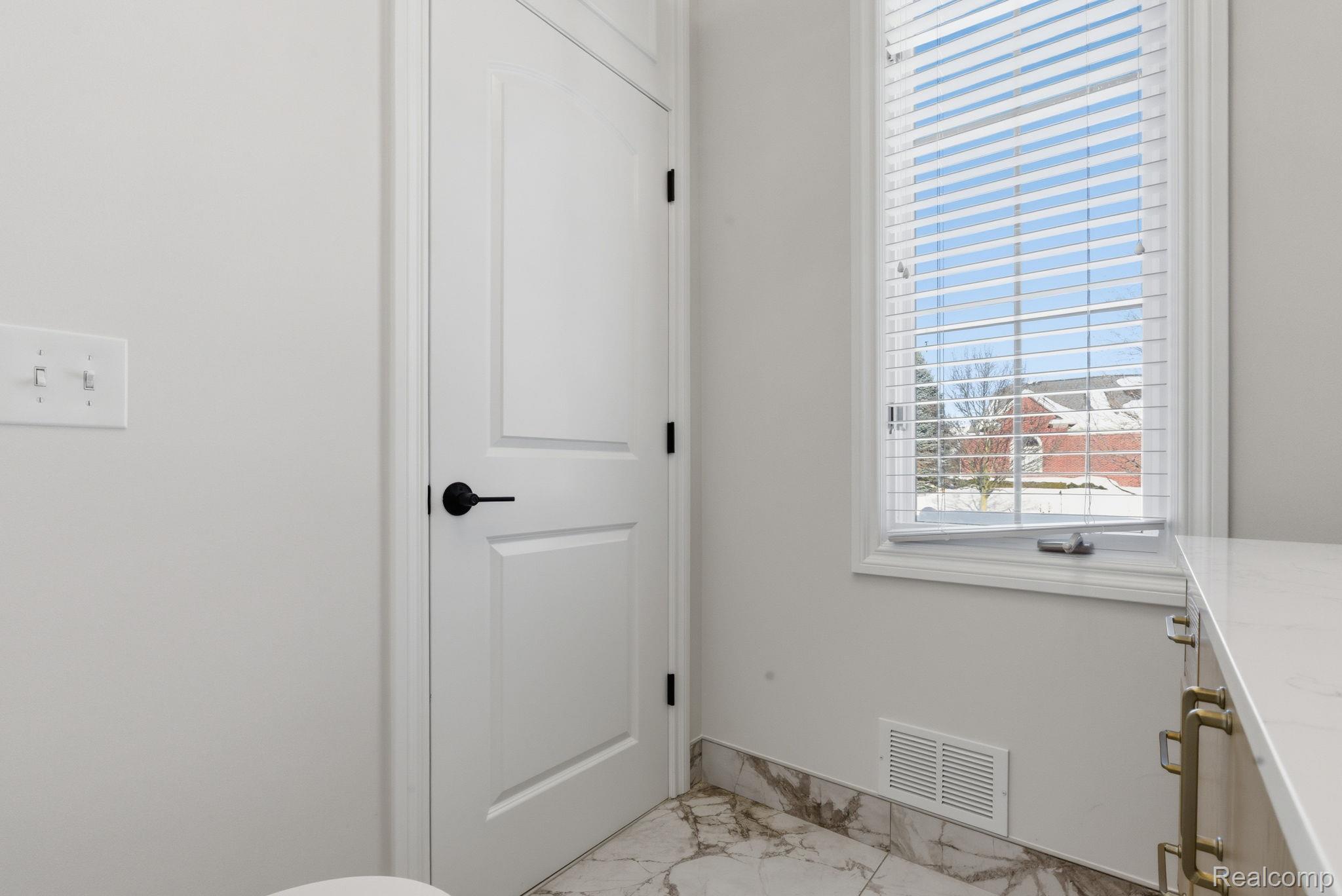 8844 Ridge Drive Washington, MI 48095 - Photo 16 of 51 Half bath featuring light marble finish floors