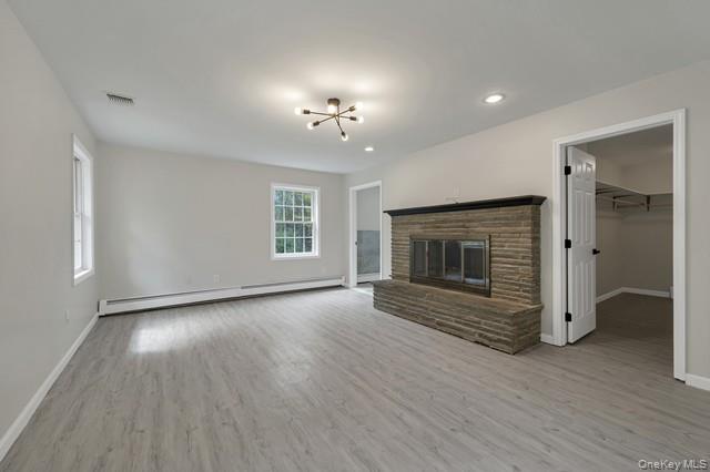 65 Old Cahoonzie Road Sparrowbush, NY 12780 - Photo 24 of 44 an empty room with wooden floor fireplace and window