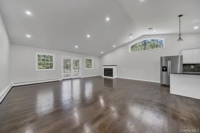 a view of a kitchen with a sink and a large window