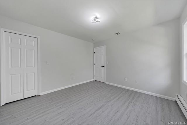 65 Old Cahoonzie Road Sparrowbush, NY 12780 - Photo 31 of 44 a view of an empty room with wooden floor