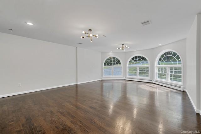 65 Old Cahoonzie Road Sparrowbush, NY 12780 - Photo 4 of 44 a view of an empty room with wooden floor and fan