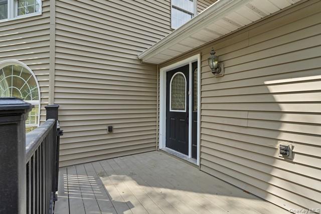 65 Old Cahoonzie Road Sparrowbush, NY 12780 - Photo 8 of 44 a view of a house with a door and a tree