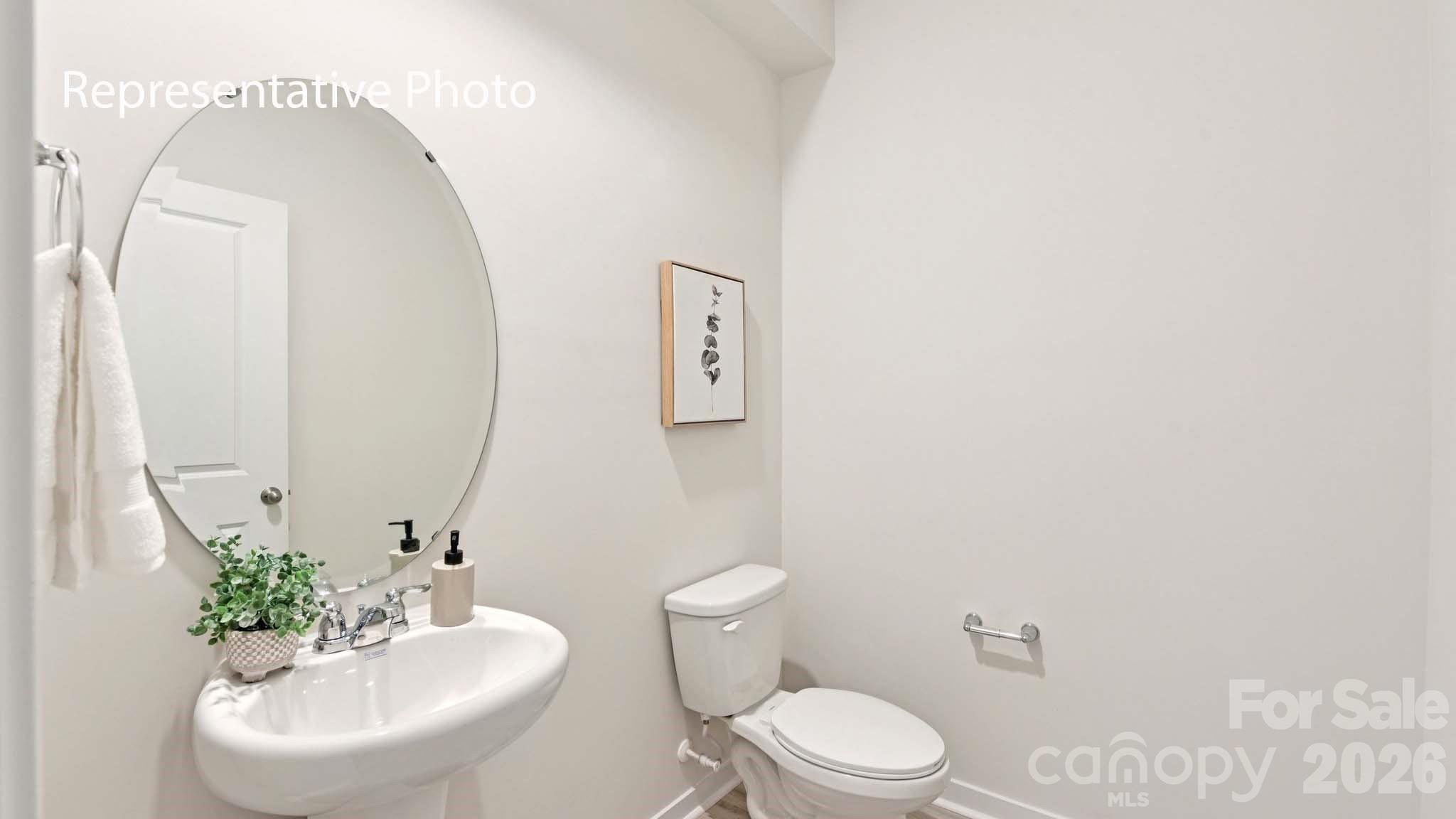 1418 Mammoth Road Hickory, NC 28602 - Photo 13 of 30 a bathroom with a sink mirror and toilet