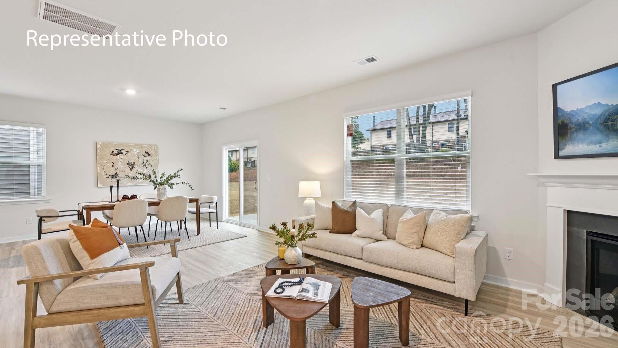 1418 Mammoth Road Hickory, NC 28602 - Photo 3 of 30 a living room with furniture a fireplace and a flat screen tv