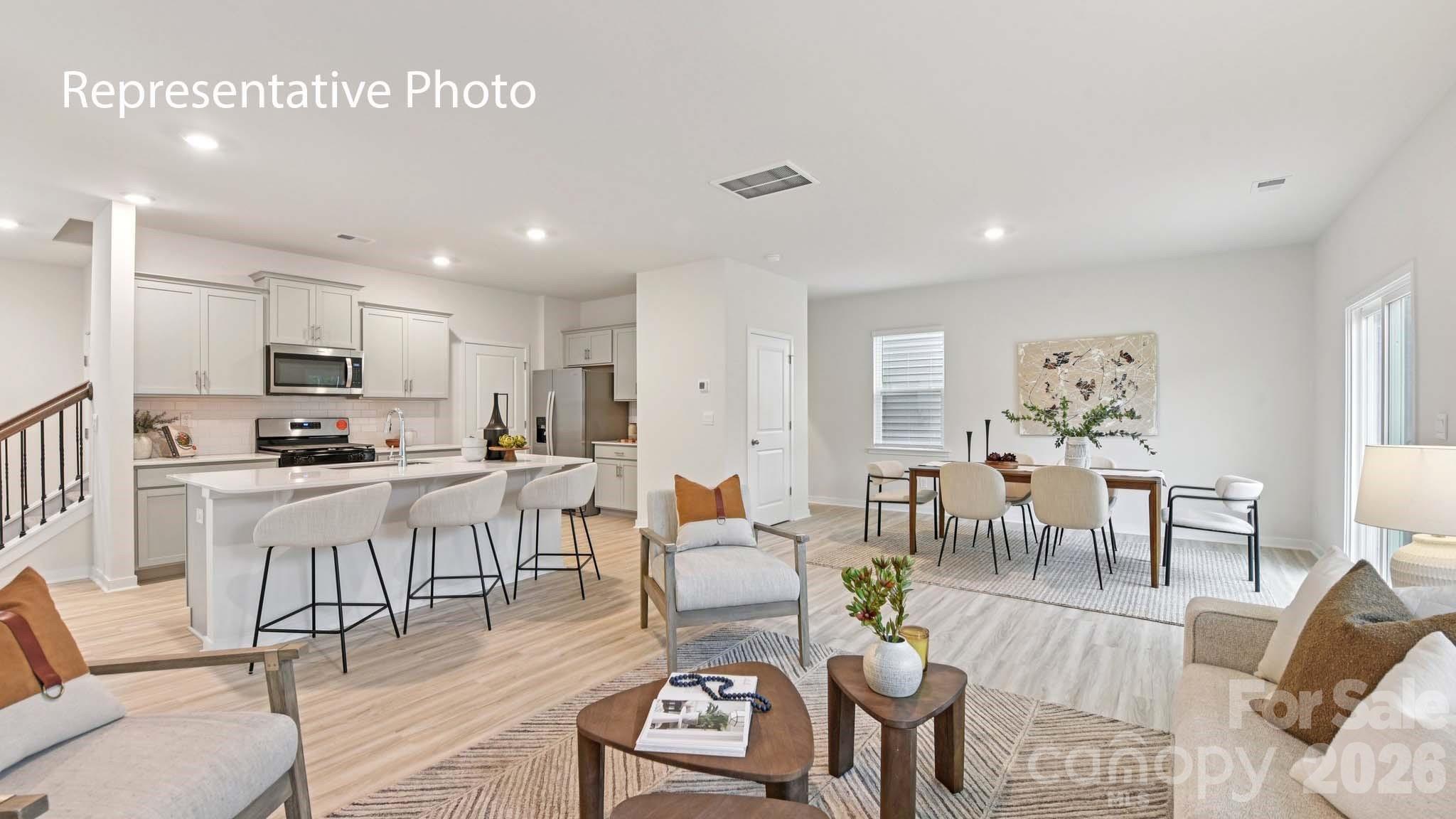 1418 Mammoth Road Hickory, NC 28602 - Photo 4 of 30 a living room with lots of furniture and kitchen view