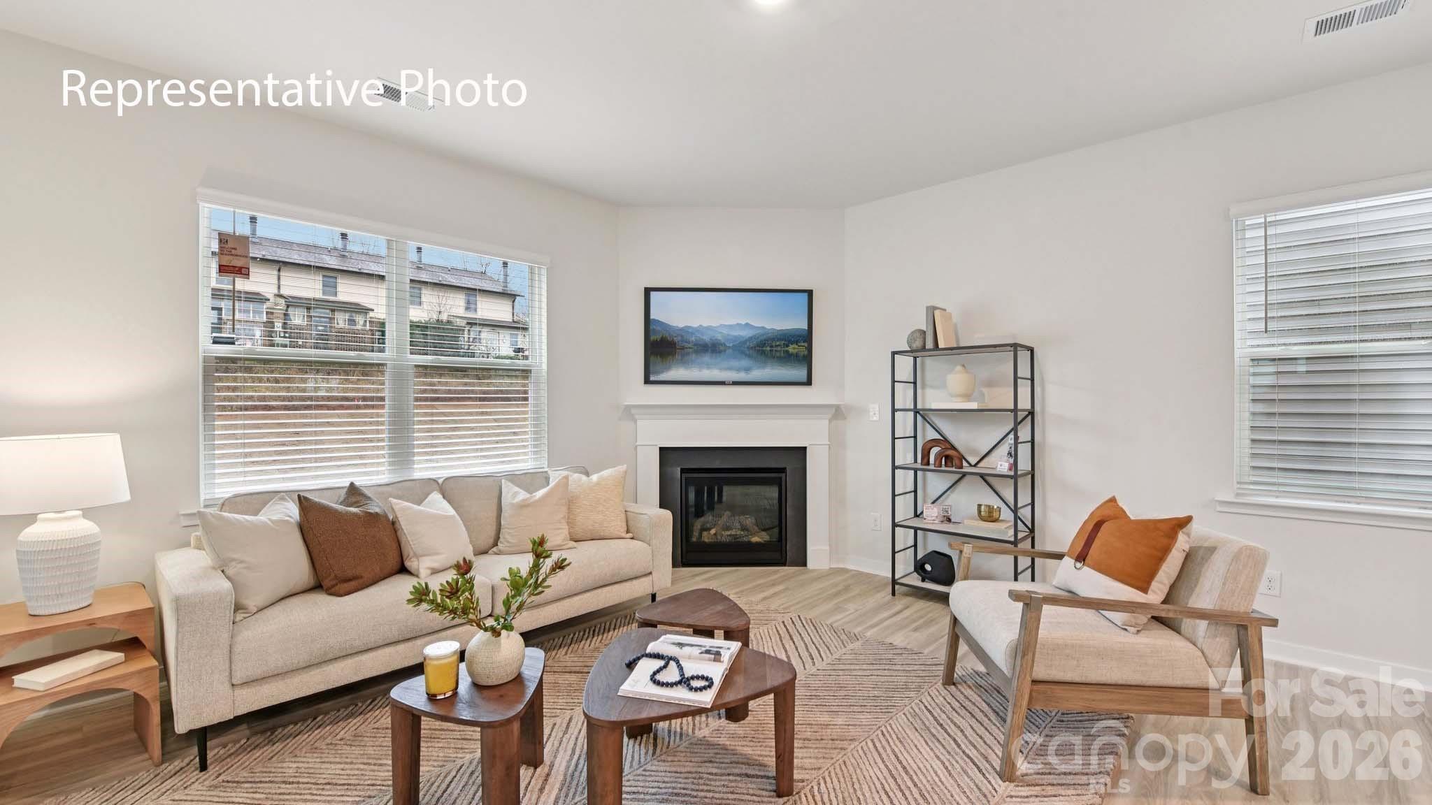 1418 Mammoth Road Hickory, NC 28602 - Photo 6 of 30 a living room with furniture a fireplace and a flat screen tv