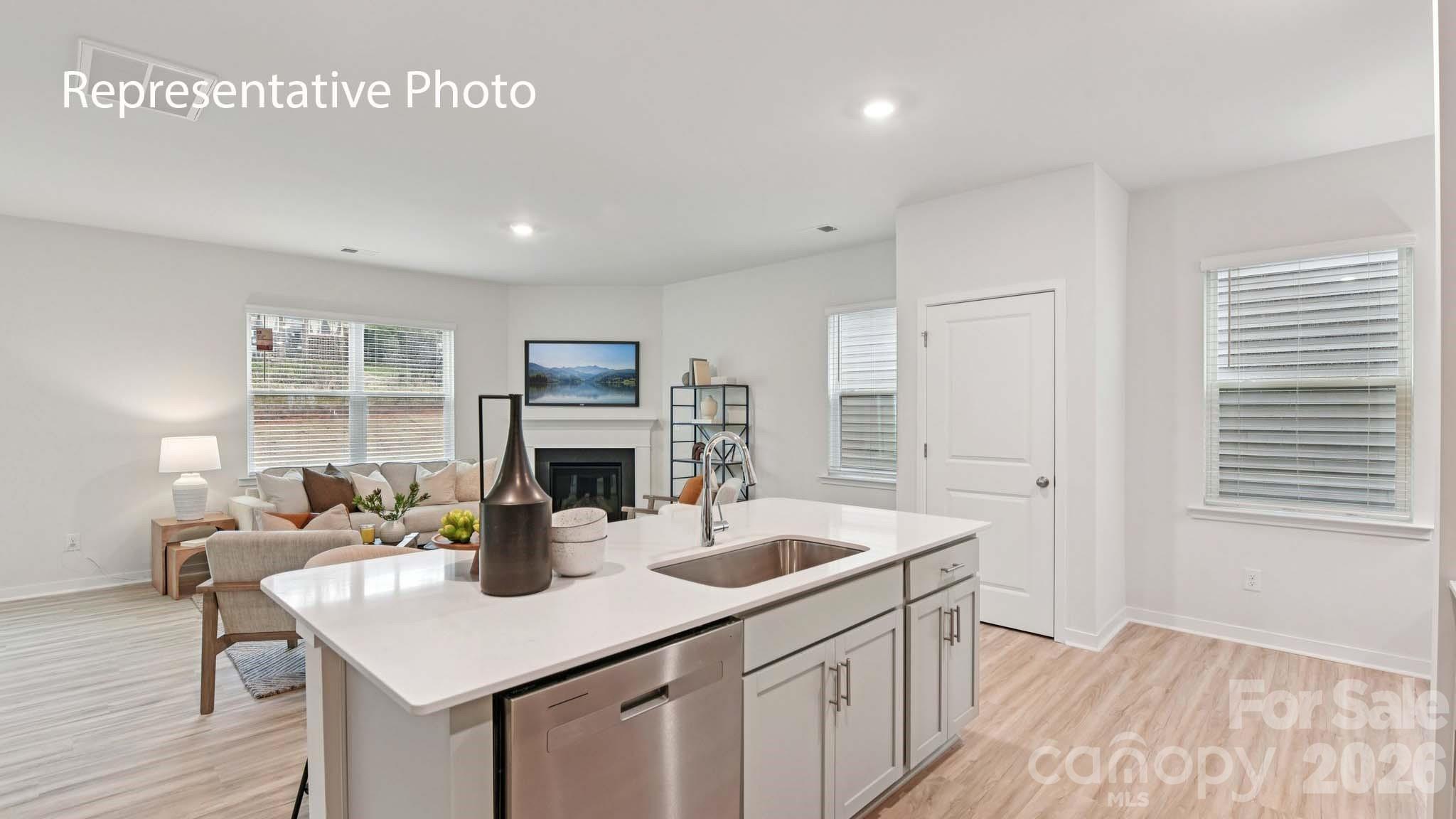 1418 Mammoth Road Hickory, NC 28602 - Photo 10 of 30 a kitchen with sink refrigerator and dining table