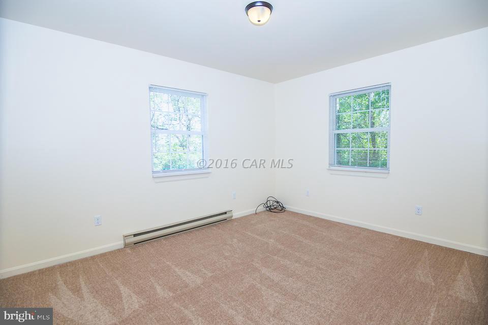29890 Deal Island Road Princess Anne, MD 21853 - Photo 23 of 32 an empty room with windows