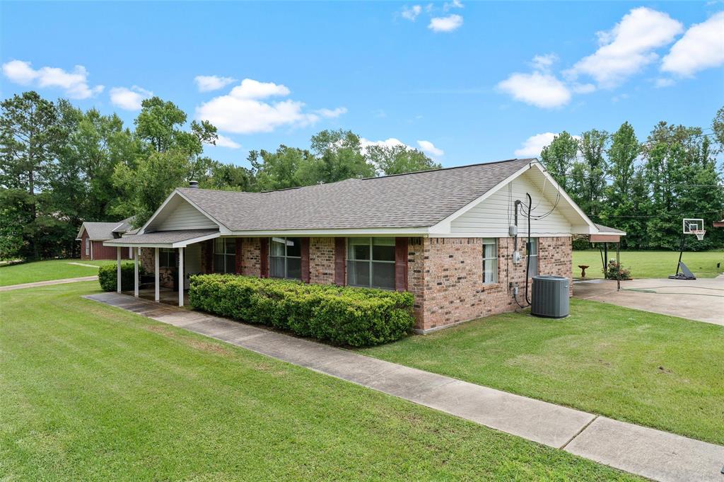 927 Stonewall-Preston Road Stonewall, LA 71078 - Photo 2 of 28 a view of a house with a yard and sitting area
