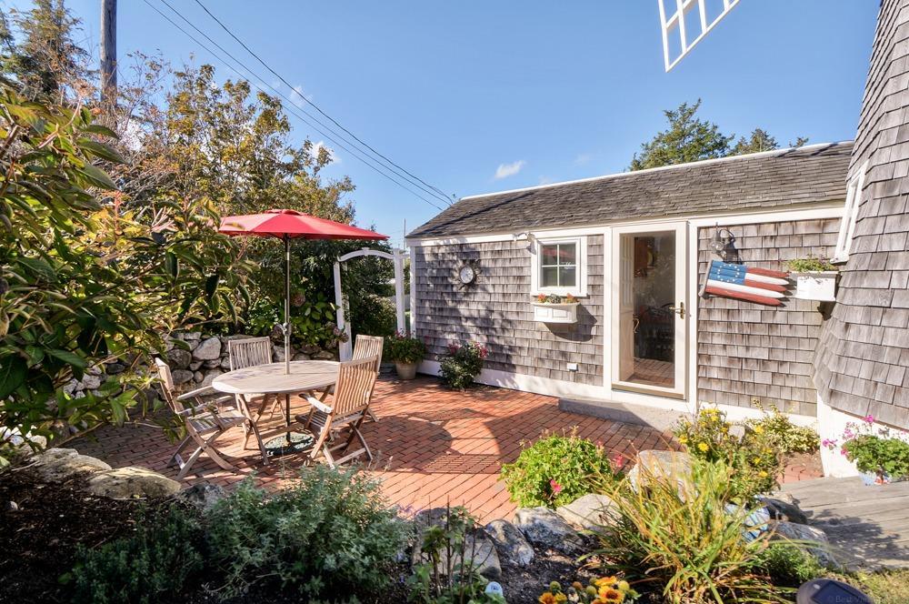 209 Shore Road, Unit 3 Chatham, MA 02633 - Photo 15 of 19 a view of a house with yard and sitting area
