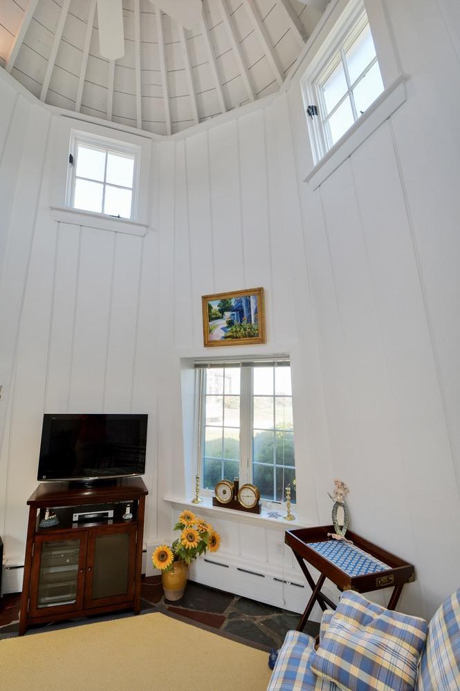 209 Shore Road, Unit 3 Chatham, MA 02633 - Photo 17 of 19 a bedroom with a bed and wooden floor
