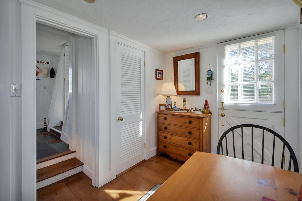 209 Shore Road, Unit 3 Chatham, MA 02633 - Photo 8 of 19 a view of a hallway with a bedroom and a window