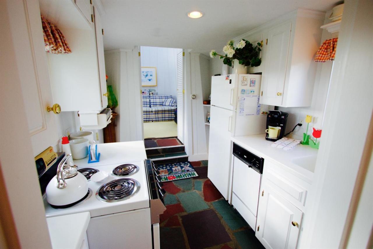 209 Shore Road, Unit 3 Chatham, MA 02633 - Photo 9 of 19 a kitchen with a refrigerator and white stove top oven