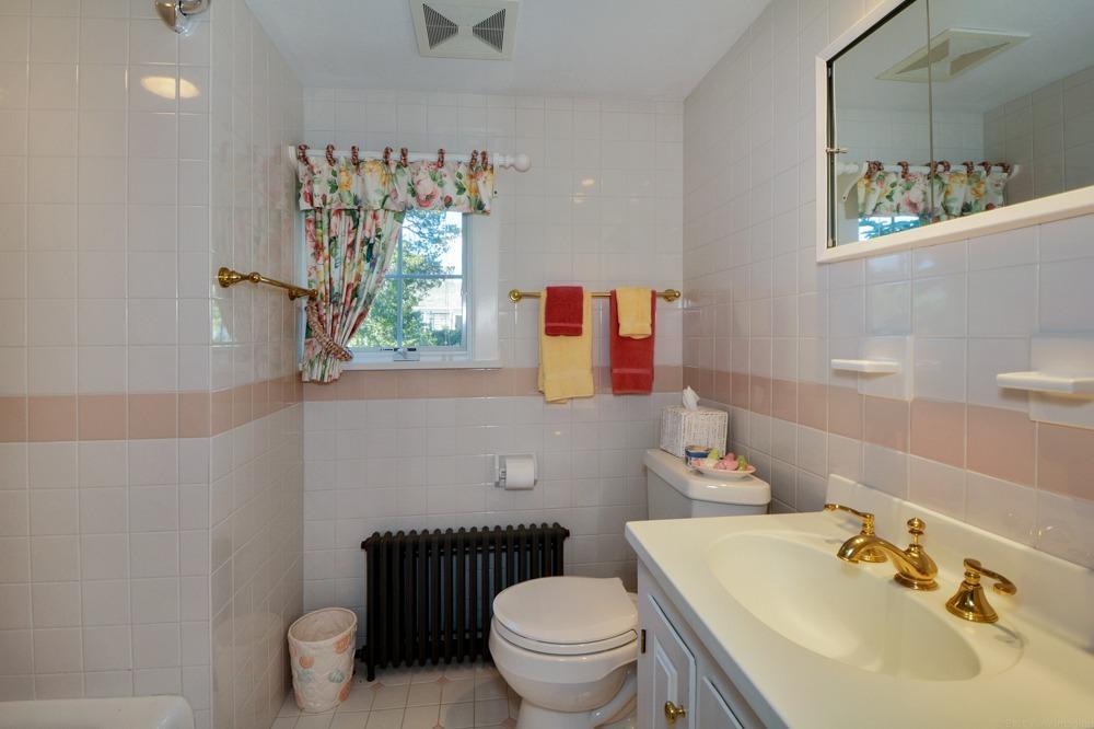 209 Shore Road, Unit 3 Chatham, MA 02633 - Photo 10 of 19 a bathroom with a sink toilet and mirror