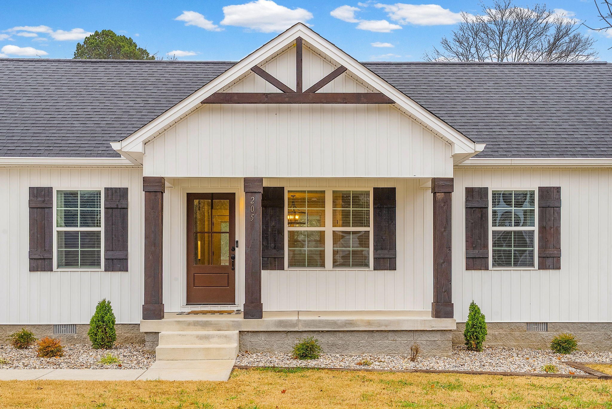 a front view of a house with a yard