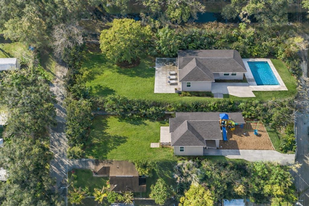 3rd Avenue Orlando, FL 32824 - Photo 3 of 16 an aerial view of a house with yard swimming pool and outdoor seating