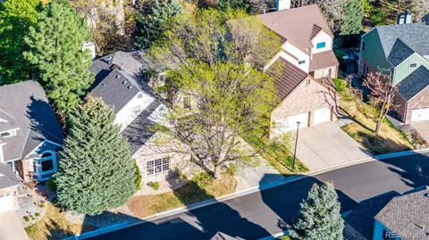 an aerial view of a house with yard