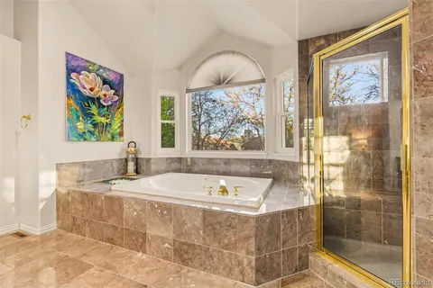 a bathroom with bathtub and window
