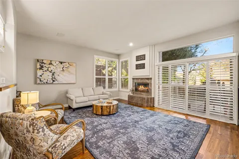 a view of a kitchen with wooden floor and a large window