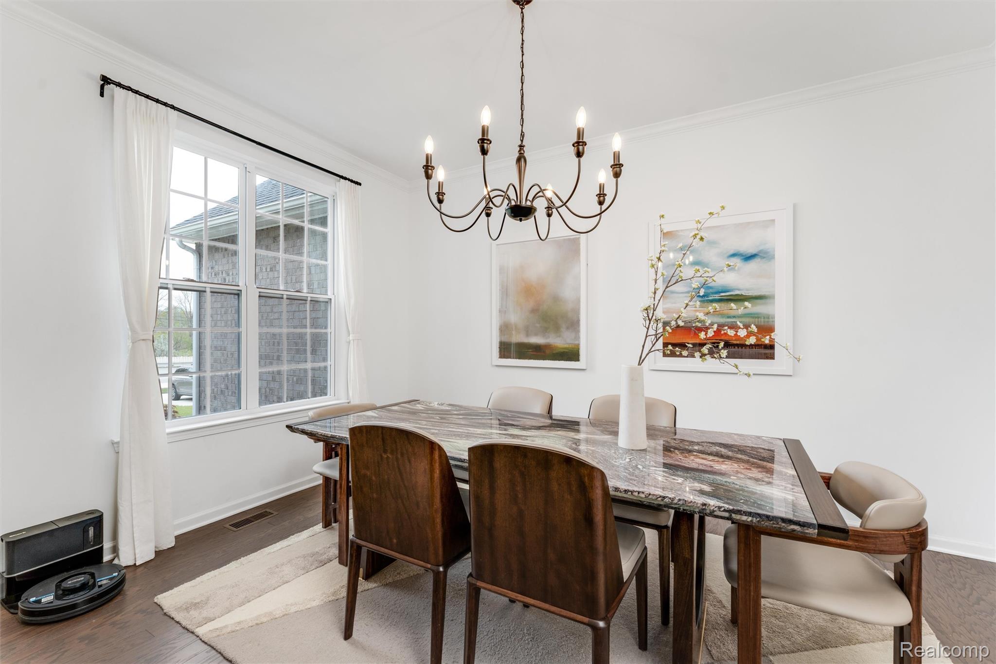 908 South Livernois Road Rochester, MI 48309 - Photo 2 of 49 Dining room with crown molding, hanging lights, and wood finished floors
