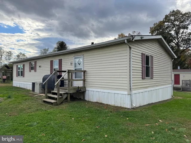 a view of a backyard with a patio