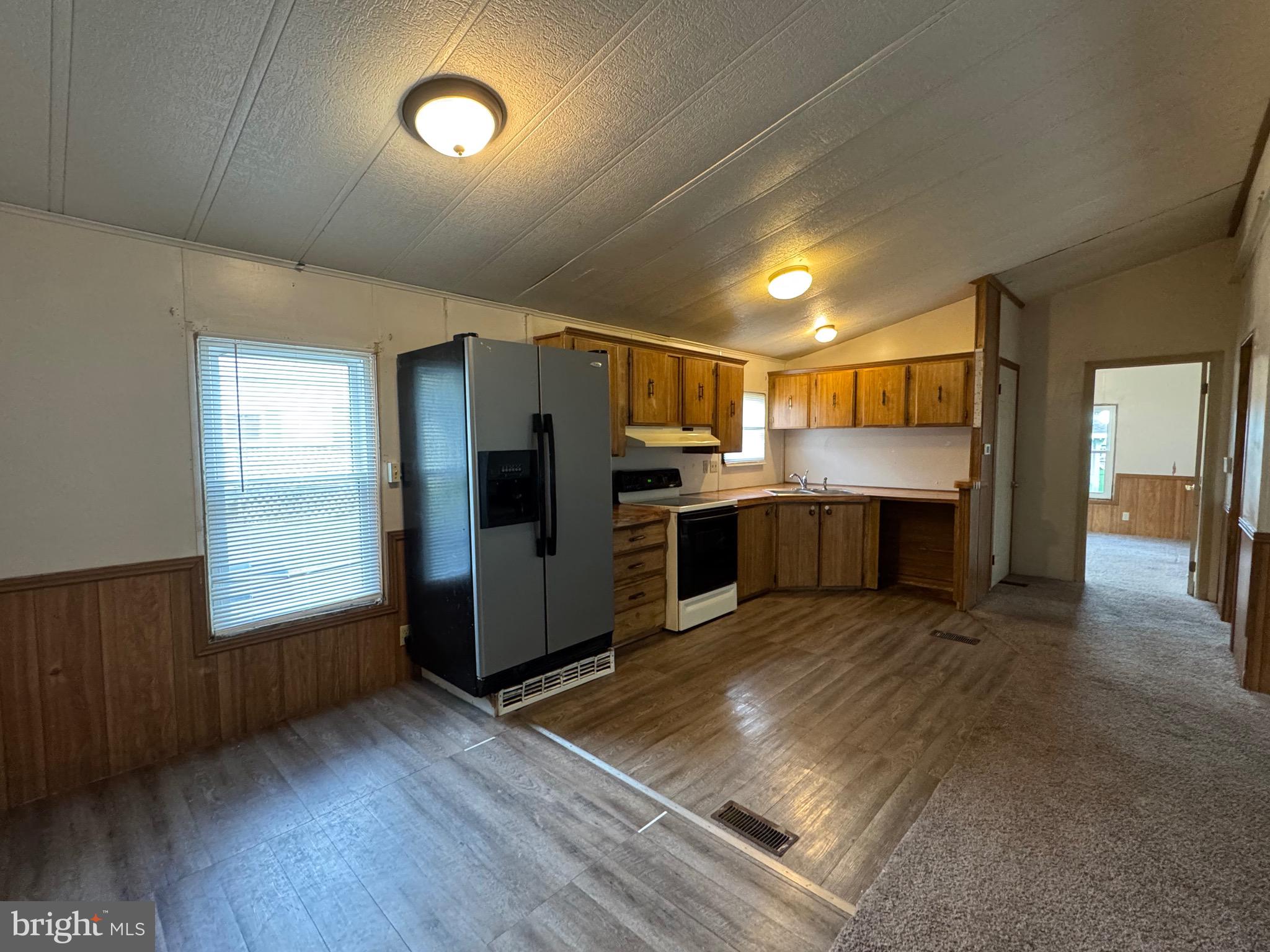 25 Hopkins Mill Road, Unit 23 New Providence, PA 17560 - Photo 8 of 14 a kitchen with refrigerator and window