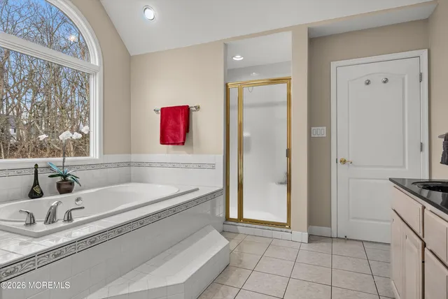 a bathroom with a sink toilet a mirror and vanity