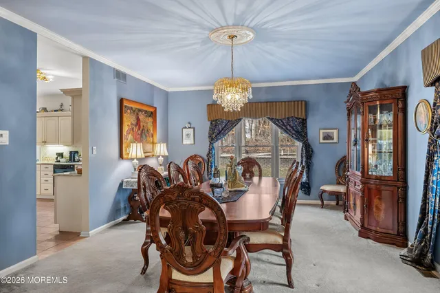 a kitchen a sink a stove and cabinets